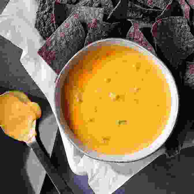A Creamy Cheddar Cheese Based Chile Cheese Dip From Ireland, Known As 'Nacho Cheese Sauce,' Featuring Chopped Onions And Red Peppers QUESO : Regional Recipes For The World S Favorite Chile Cheese Dip A Cookbook